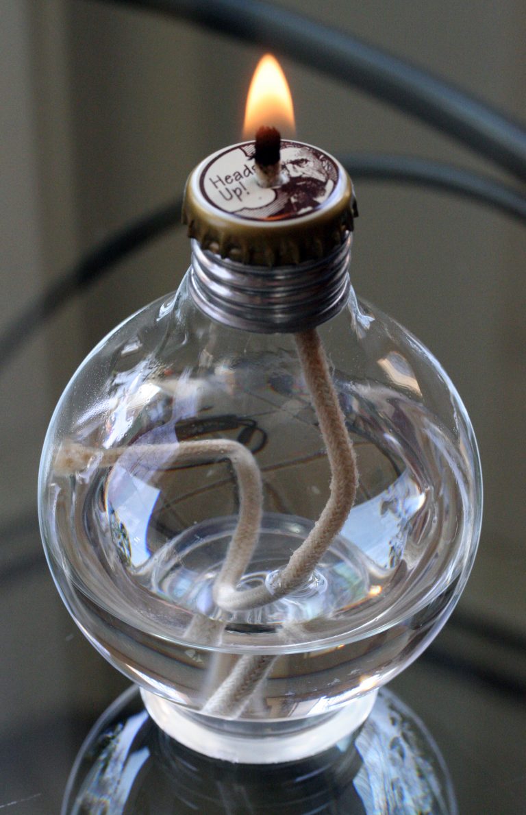 An oil lamp made from an incandescent bulb